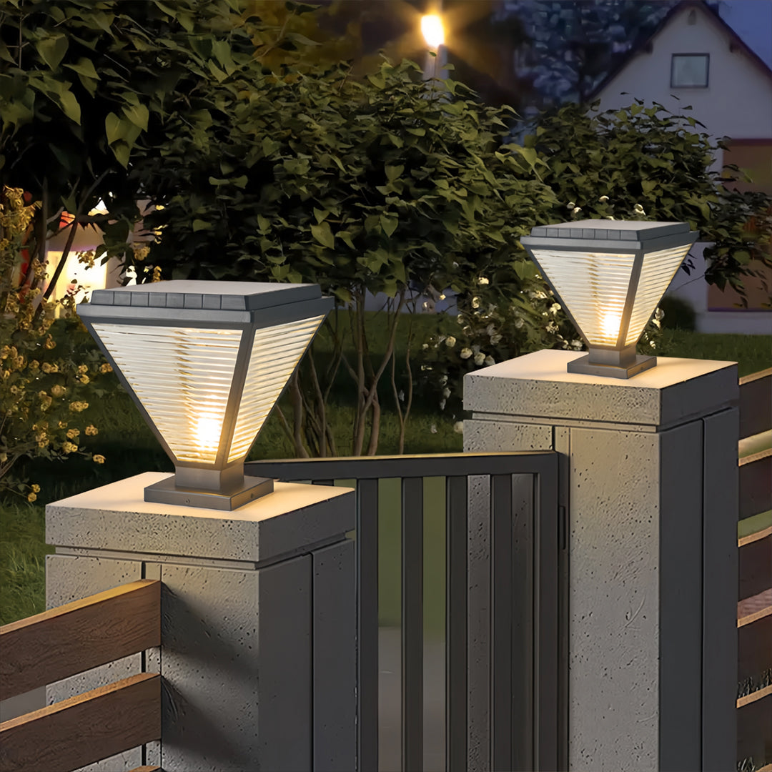 Contemporary pillar lights led installed on concrete posts with warm night glow.