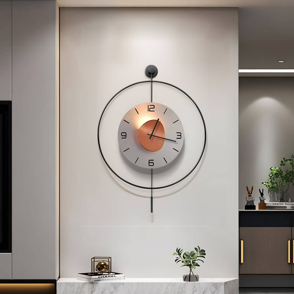 Night light wall clock illuminating a contemporary living room with a gray sofa.