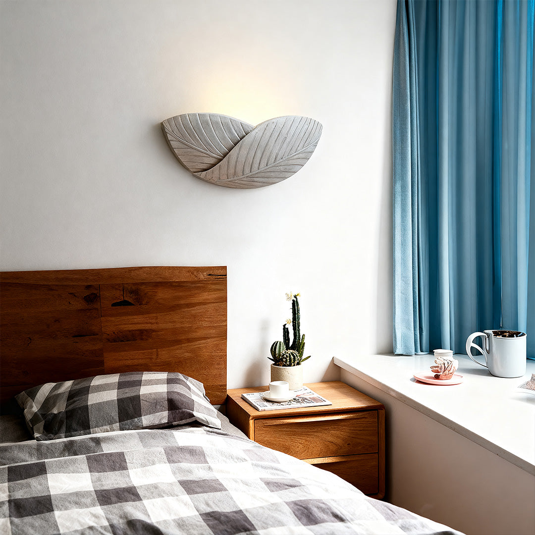 Pair of night wall lights with flared ceramic design flanking modern bathroom vanity mirror