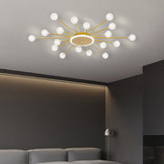 Starburst ceiling light with globe bulbs creating warm ambient lighting in modern hallway