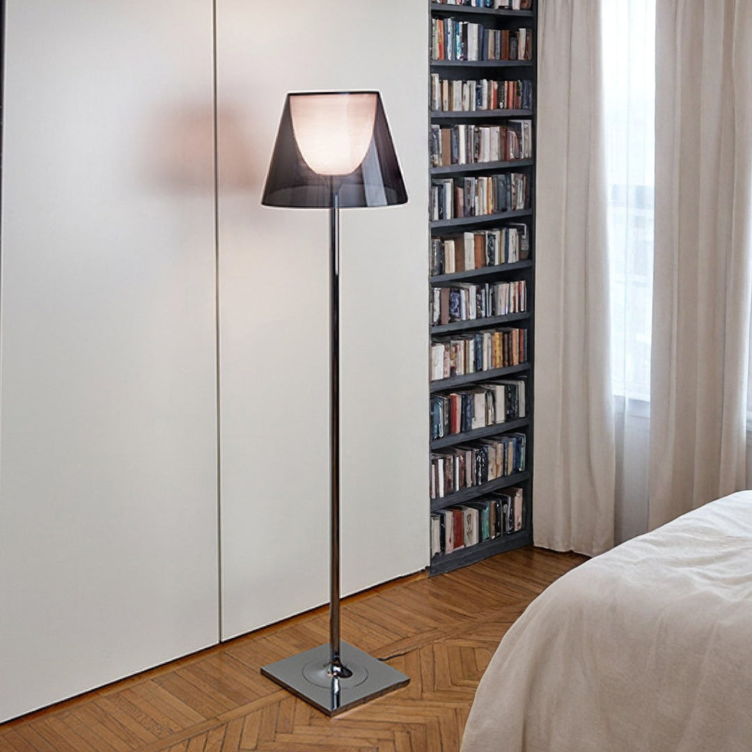 Nordic floor lamp in minimalist bedroom beside bookshelf creating soft reading light atmosphere