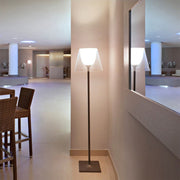 Pair of Nordic floor lamps in modern bedroom providing balanced ambient lighting and symmetry