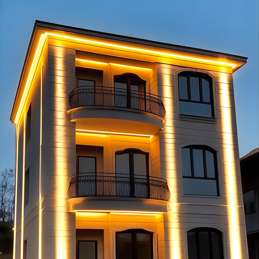 Office building facade with vertically aligned square wall wash light.