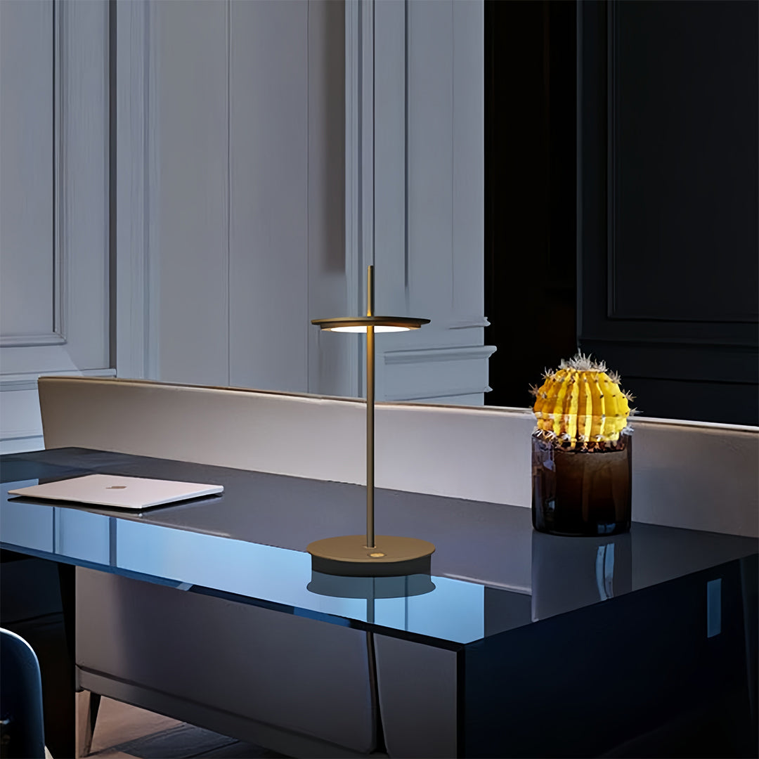 Contemporary dimmable table lamp illuminating modern office space with blue marble desk surface