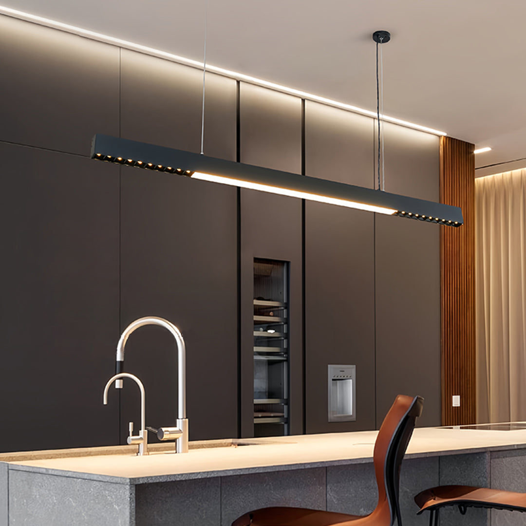 Modern office space with suspended linear light pendant creating clean professional atmosphere