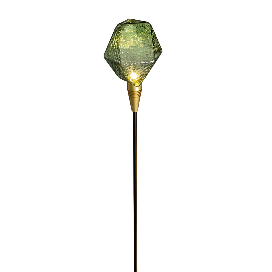 Olive-green globe stake light on a slim black rod, designed for decorative landscape lighting pathway use.