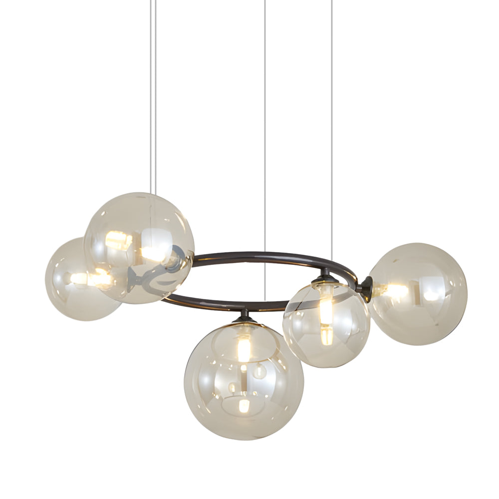 Opal glass globe chandelier with a black frame, hanging in a contemporary dining room.