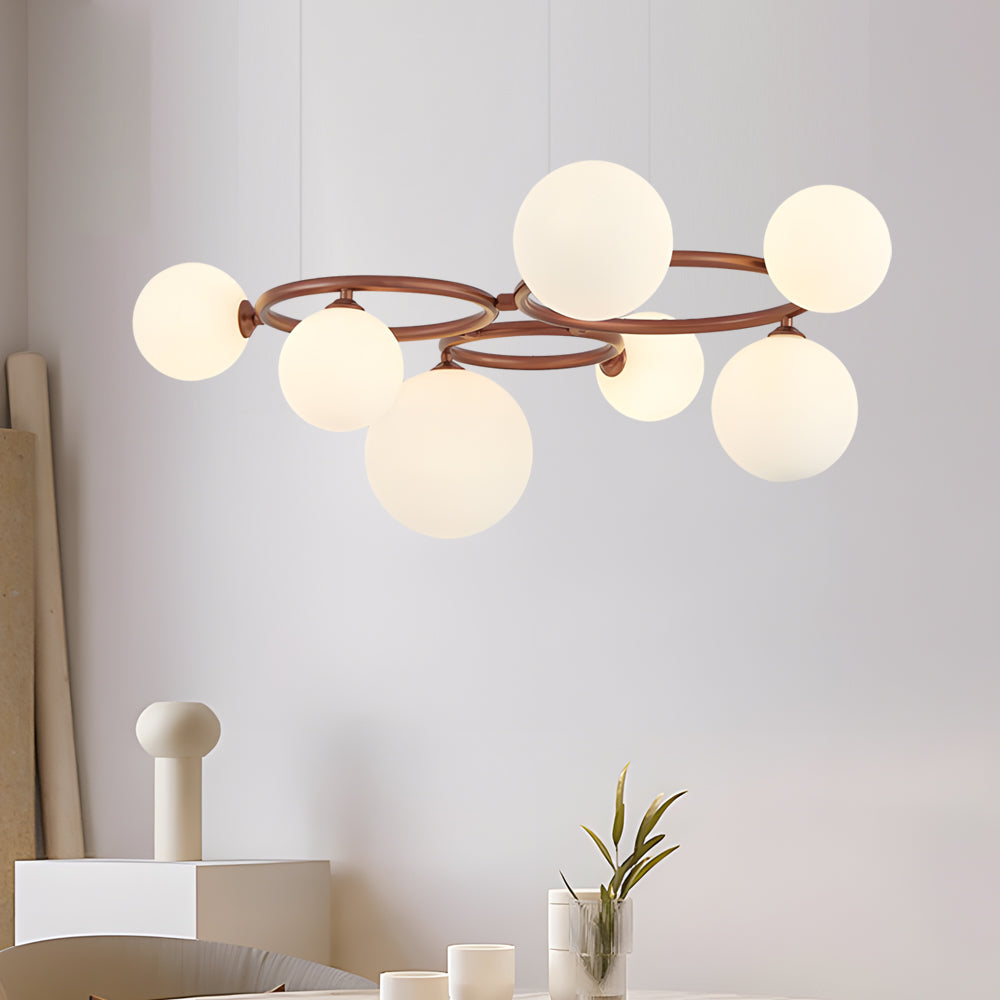 Opal glass globe chandelier with a black frame, enhancing a modern interior.