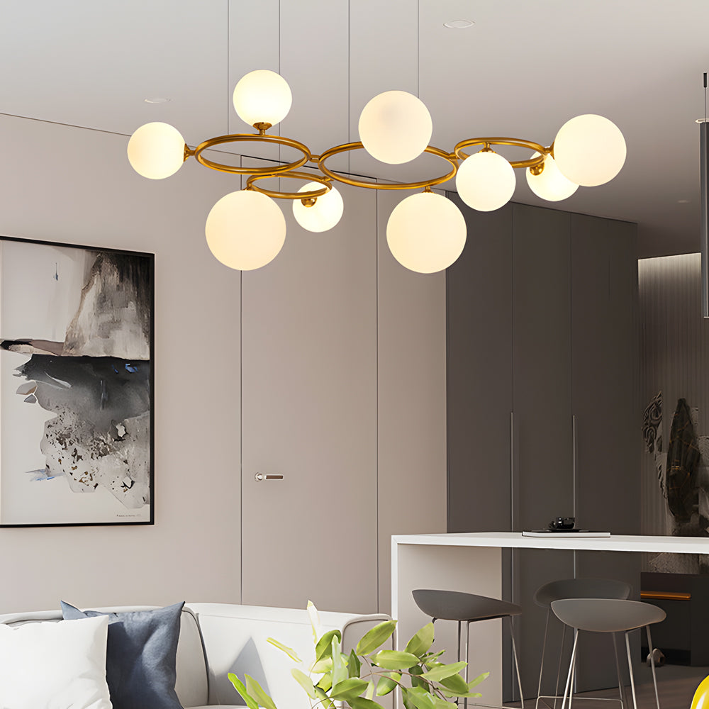 Opal glass globe chandelier with a black frame, illuminating a stylish bedroom.