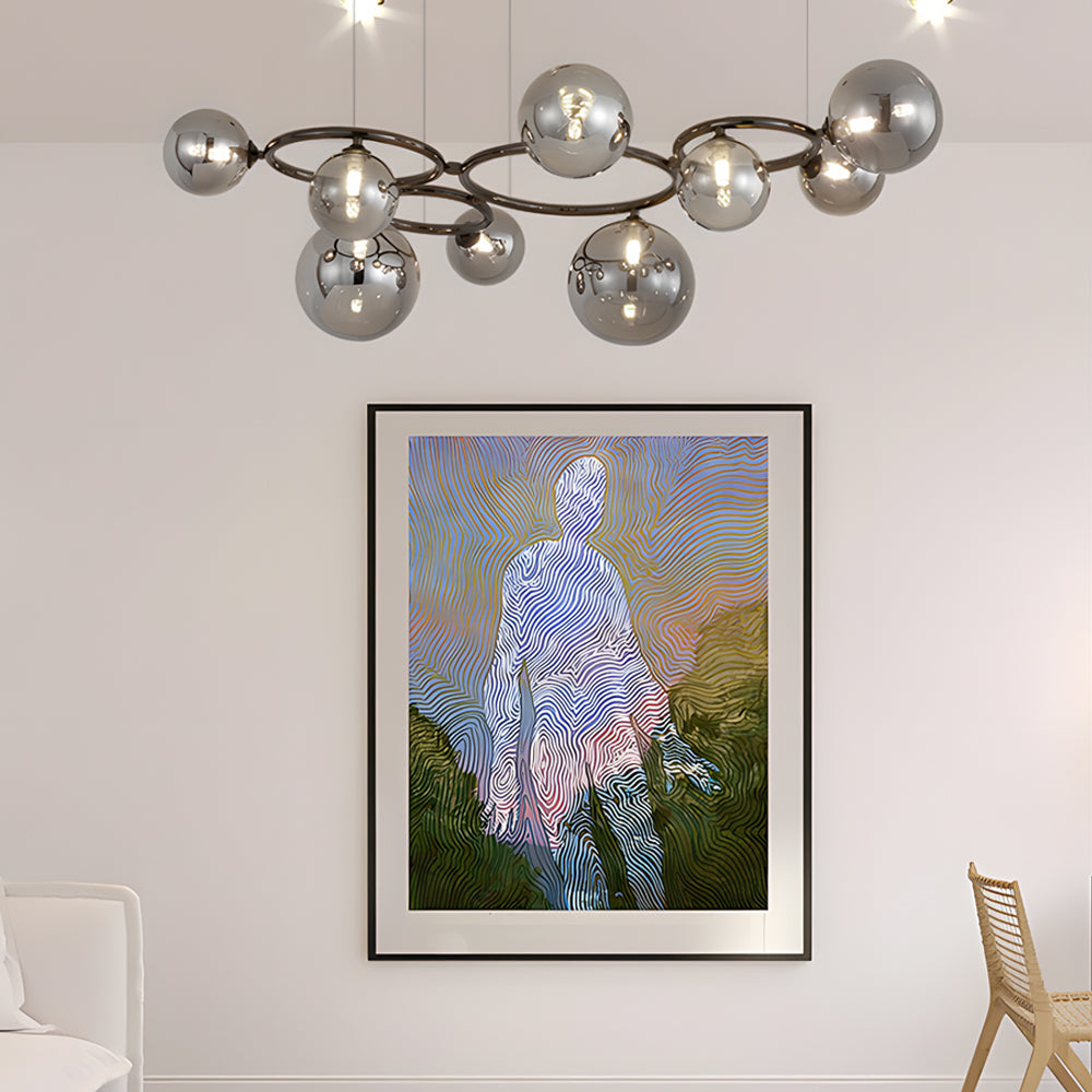 Opal glass globe chandelier with a black frame, enhancing a modern interior with warm light.