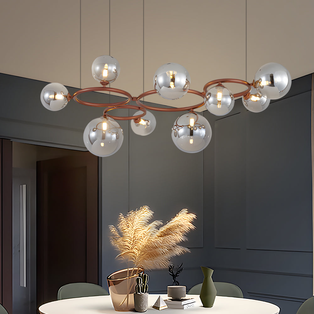 Opal glass globe chandelier with a copper frame, providing ambient lighting in a cozy living room.