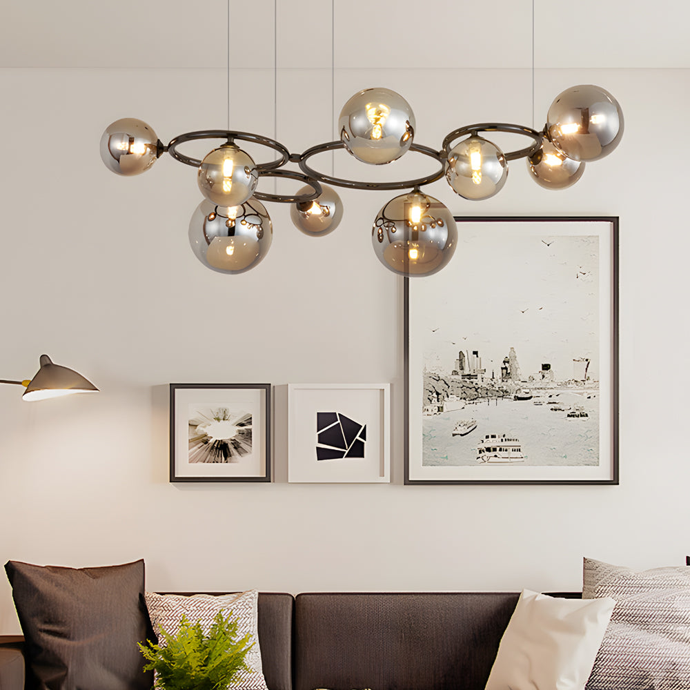 Opal glass globe chandelier with a copper frame, providing soft light in a modern bedroom.