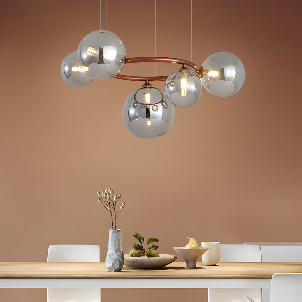 Opal glass globe chandelier with a minimalist design, hanging above a modern dining area.