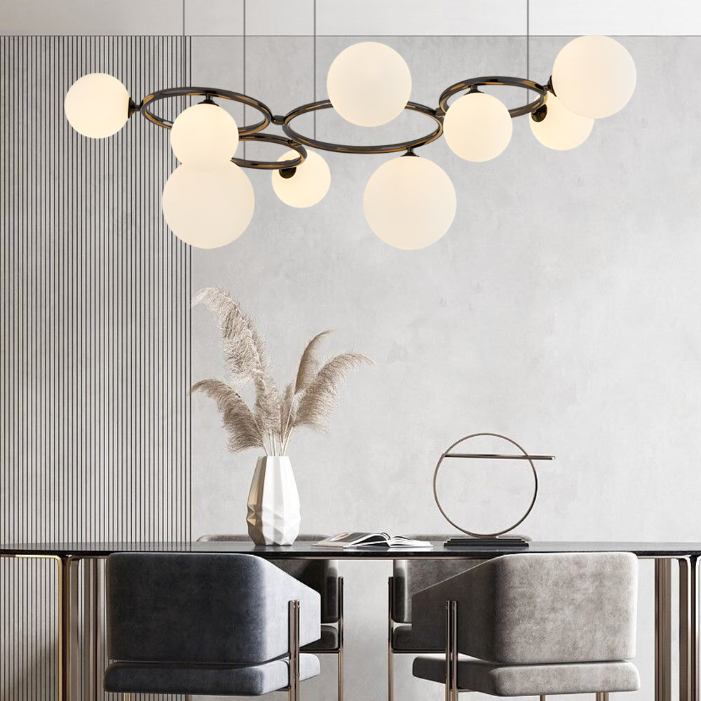 Opal glass globe chandelier with a modern design, hanging above a contemporary dining table.