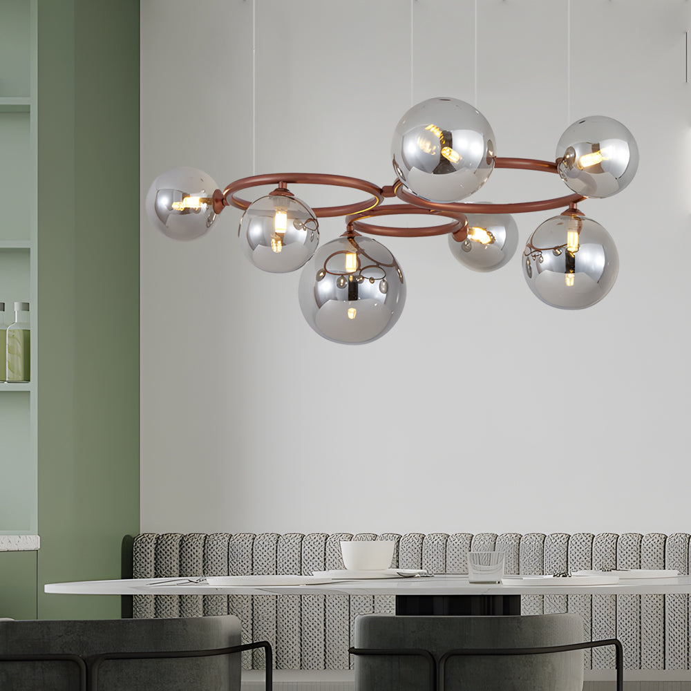 Opal glass globe chandelier with a modern design, hanging above a minimalist dining table.