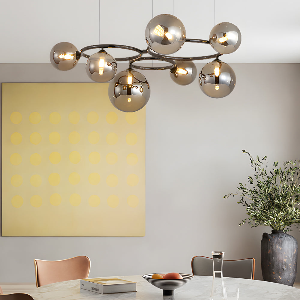 Opal glass globe chandelier with a sleek design, hanging in a modern living room.