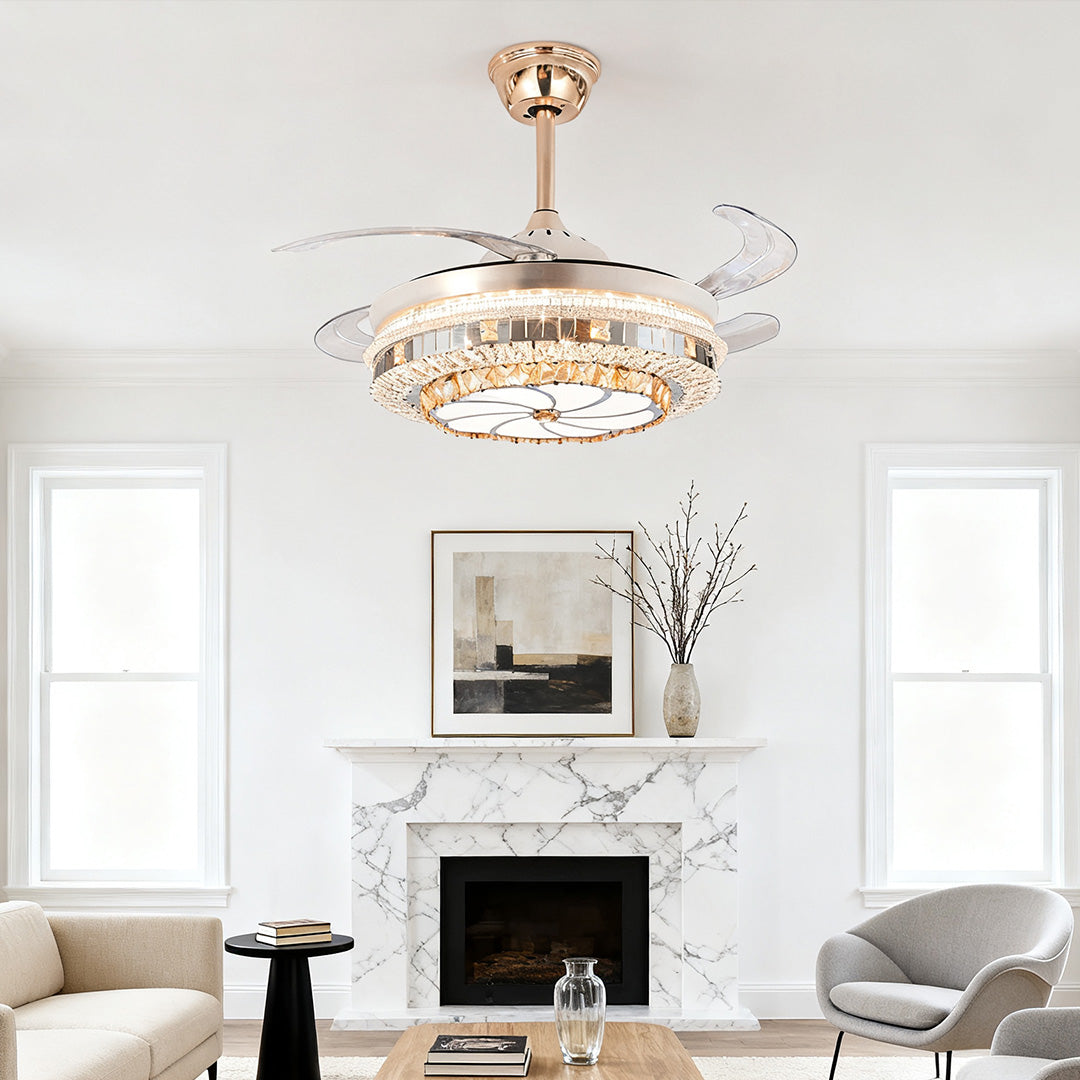 Opulent gold ceiling fan with light and sparkling crystal accents in a white living space 
