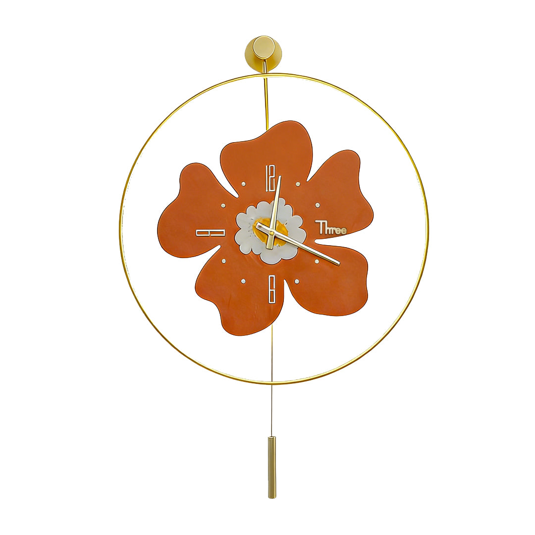 Vibrant orange flower shaped wall clock with light on a clean white background.