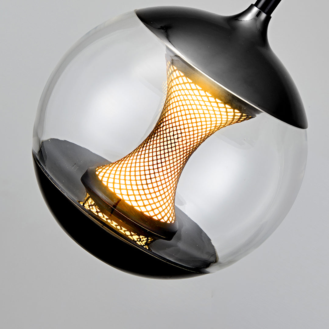 Close-up detail of orb pendant light showing decorative mesh pattern inside smoked glass sphere with black exterior