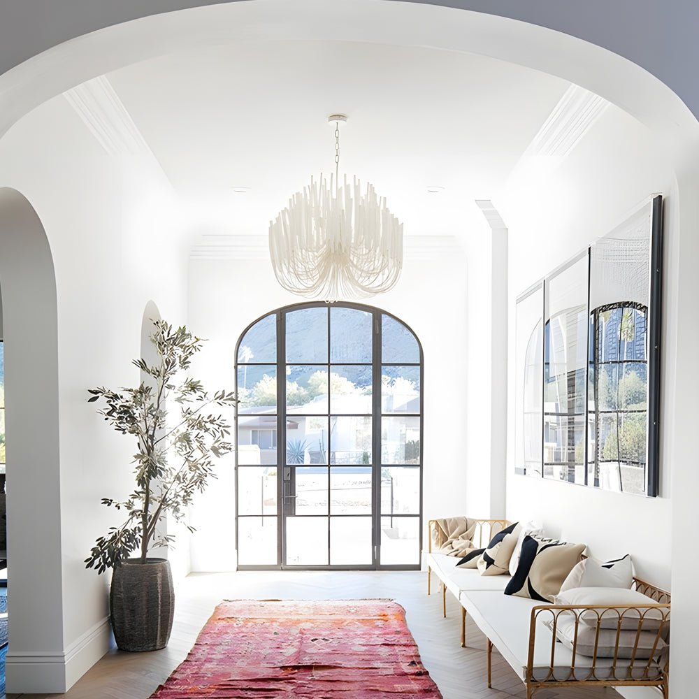 Organic stick chandelier in an entryway with high ceilings, creating a grand and welcoming first impression.