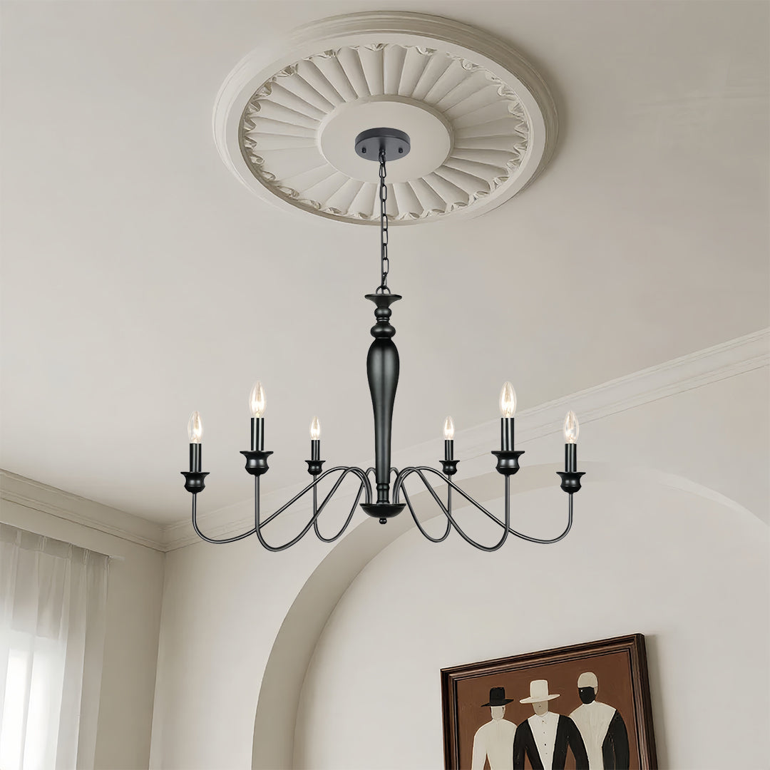 Ornate black candle chandelier with ceiling medallion providing ambient lighting in classic dining room