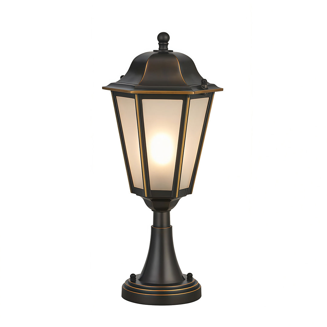 Ornate black outdoor pillar light featuring intricate metalwork and clear glass for sophisticated exterior lighting.