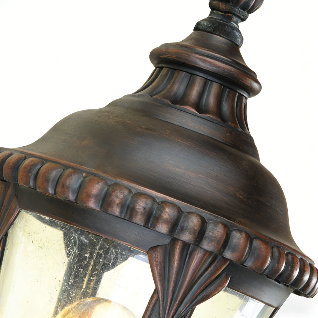 Ornate fence pillar light with intricate bronze detailing and beaded trim, perfect for classic garden or pathway illumination.