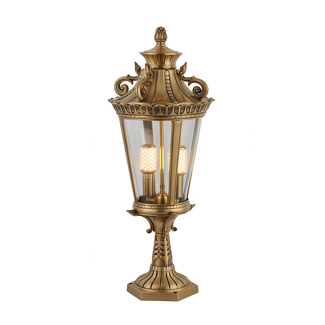 Ornate gold glass pillar lights with detailed metalwork, ideal for sophisticated garden or pathway illumination.