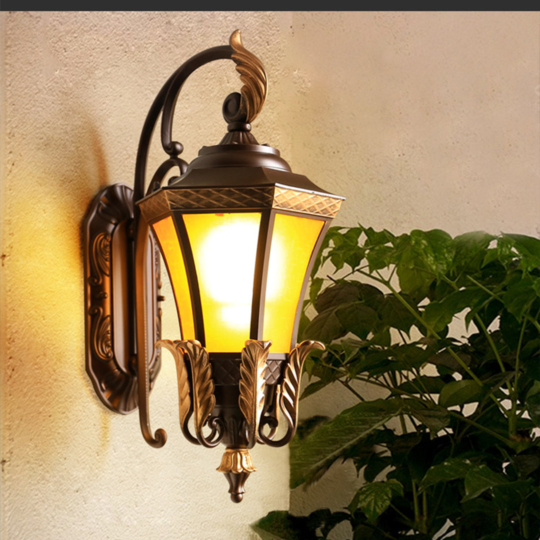 Detailed view of ornate lantern mounting hardware featuring decorative bronze scrollwork and traditional blacksmith craftsmanship