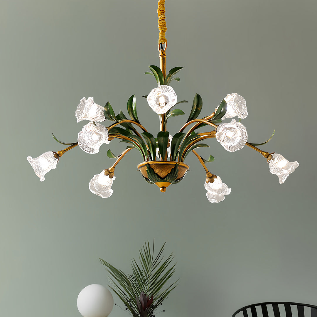 Ornate vintage floral chandelier with white blooms creating dramatic focal point against neutral walls