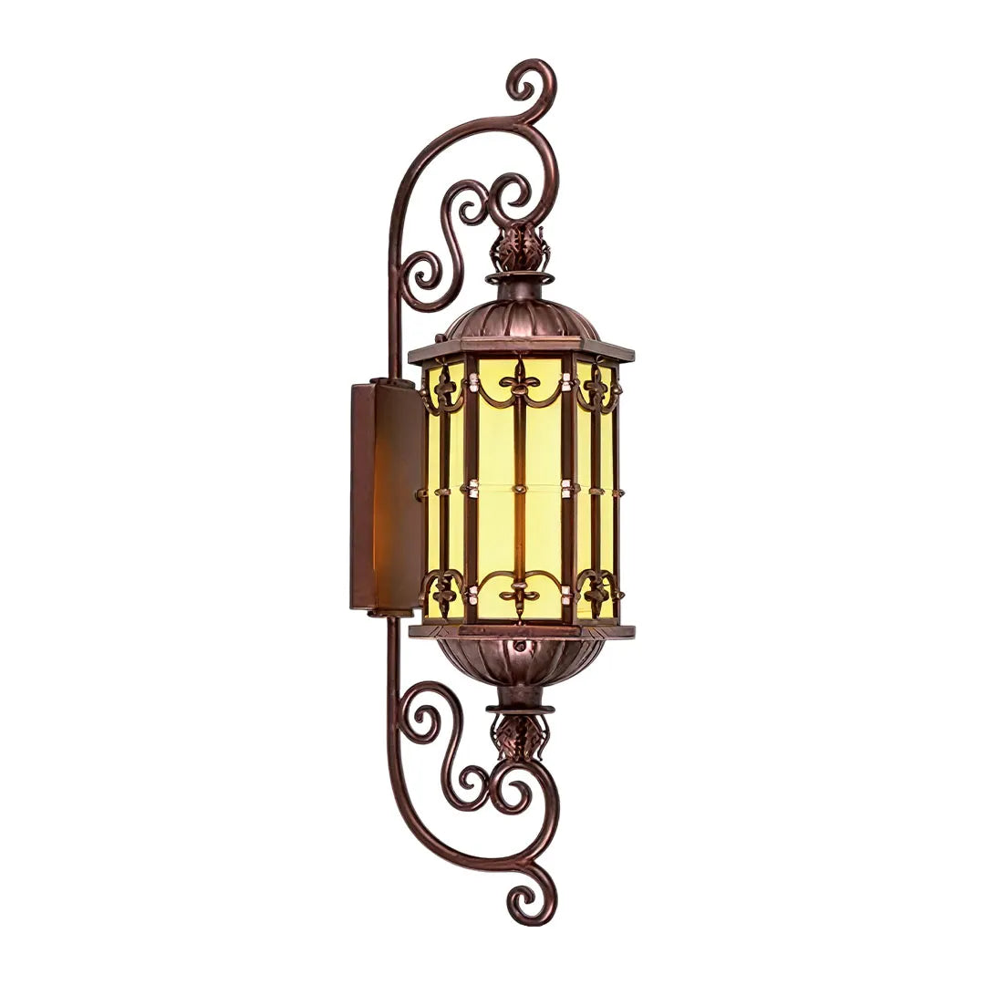 Vintage wall sconce lighting featuring ornate scrollwork, a bronze finish, and warm glass panels.