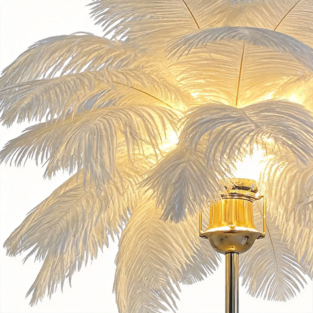 Ostrich feather table lamp with a white feather design, providing soft illumination.