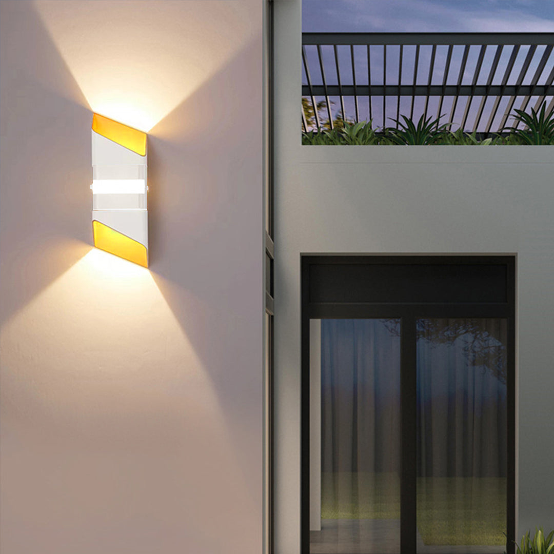 Outdoor architectural wall light on building exterior with tropical evening atmosphere