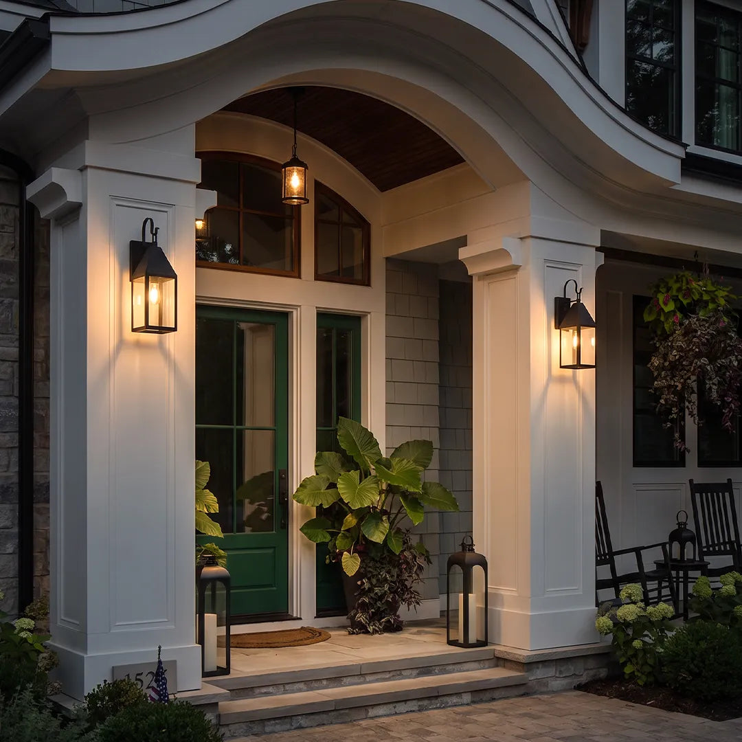 Outdoor black sconce flanking a covered front entry, creating a welcoming and elegant exterior lighting design.