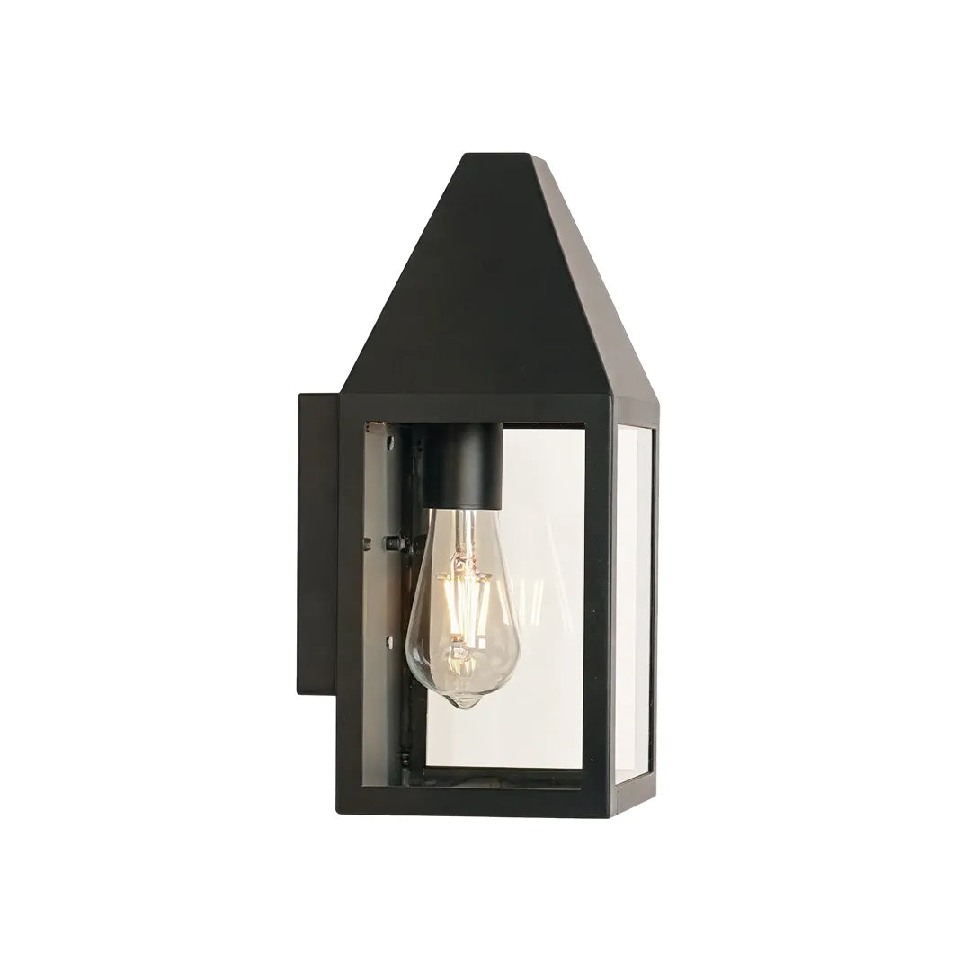 Outdoor black sconce product image with a clean tapered lantern silhouette and clear glass enclosure.
