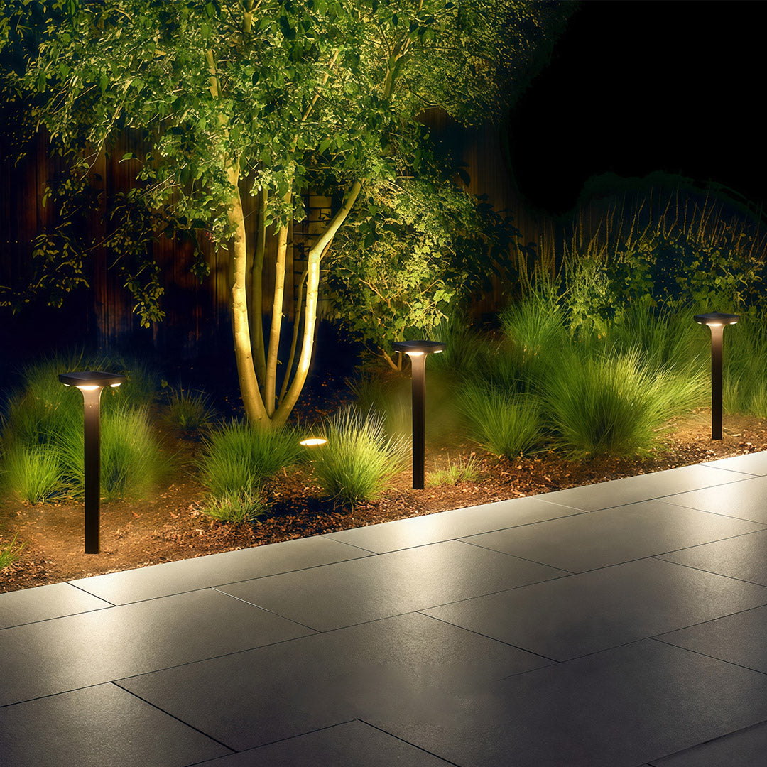 Outdoor black wall light mounted beside a window, providing light for the porch area.