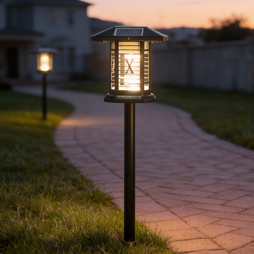 Outdoor bug repellent lights illuminating a garden pathway with warm, insect-repelling glow.
