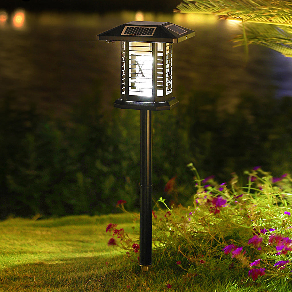Outdoor bug repellent lights providing soft illumination in a flower garden.
