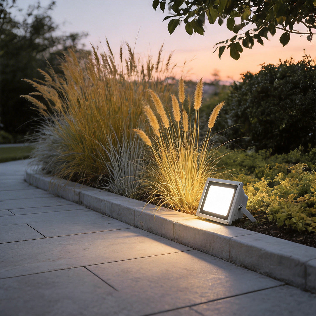 Outdoor flood lights LED with a modern design, enhancing a landscaped garden.