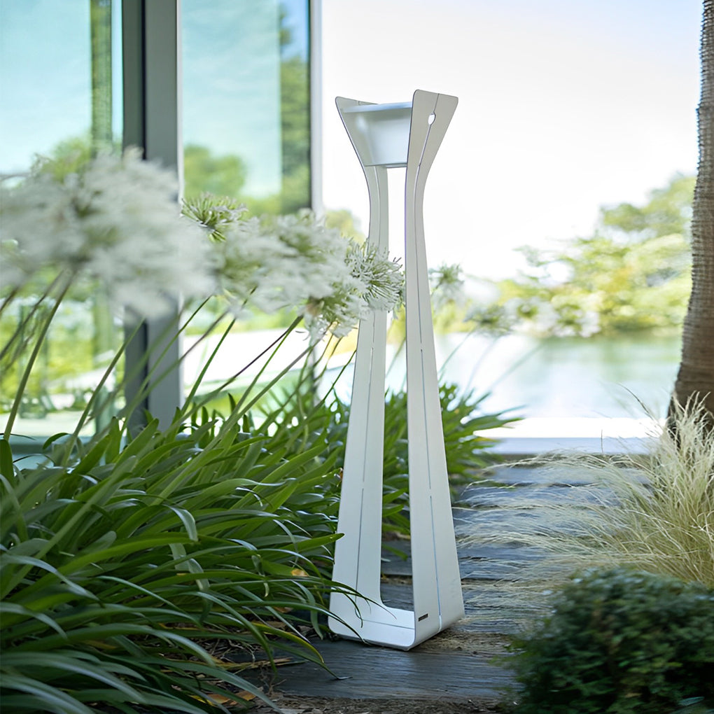 White outdoor floor lamps for porches beside greenery and water, delivering clean modern lighting for outdoor living areas.