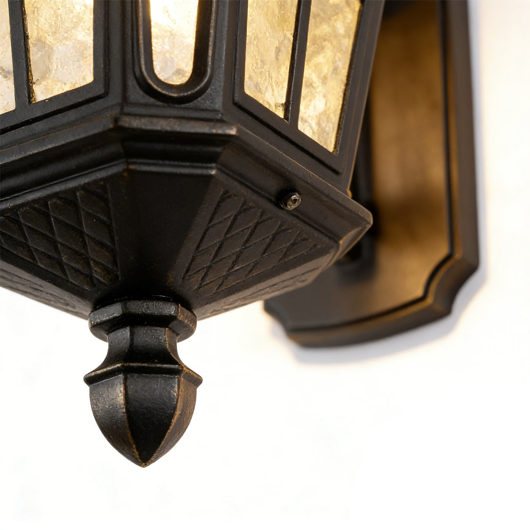 Outdoor front porch lights with a close-up of their frosted glass panels.