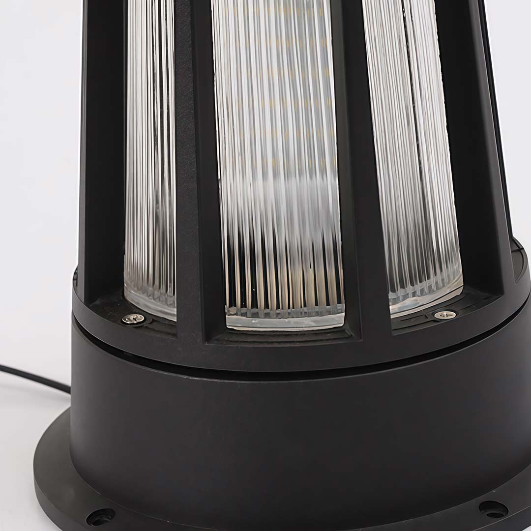 Outdoor garden path lamp providing ambient light along a stone garden path.