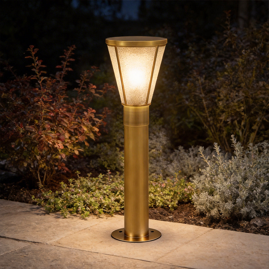 Outdoor garden path lights with a modern design, illuminating a landscaped garden at dusk.