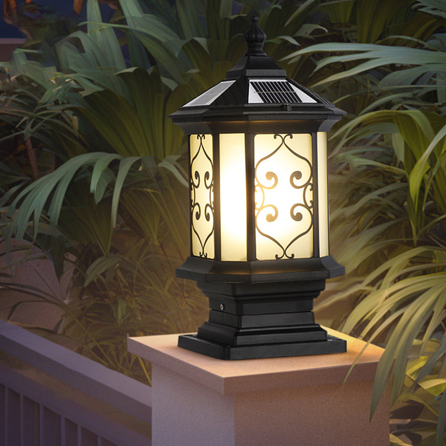 Outdoor gate pillar lights with a black metal frame, adding a modern touch to garden decor.