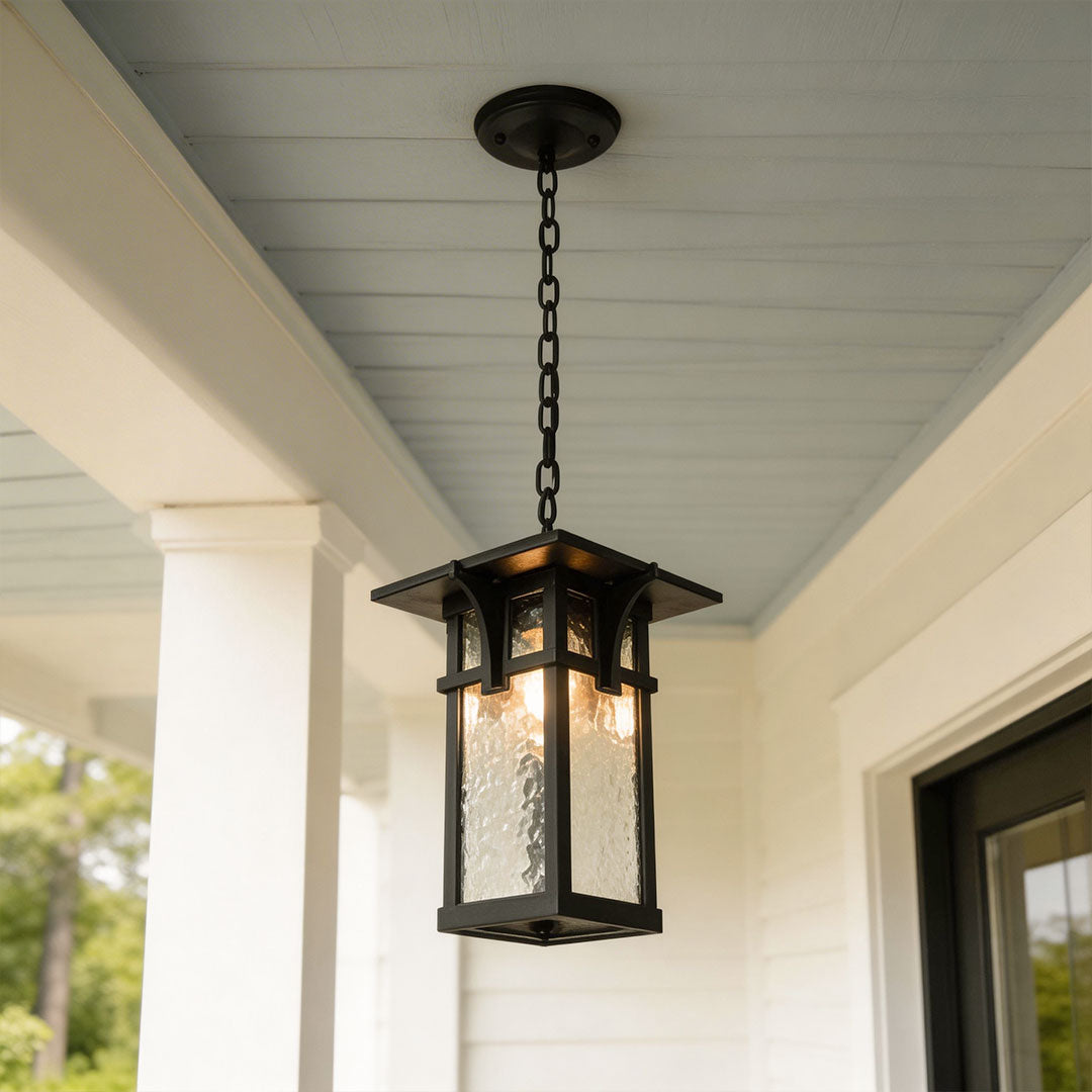 Outdoor hanging ceiling light fixtures with a classic design, mounted under a porch roof.