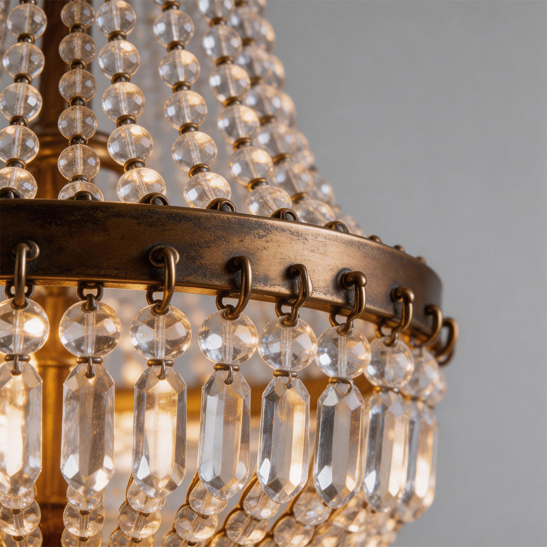 Close-up of outdoor hanging lantern light fixtures showcasing crystal and metal details.