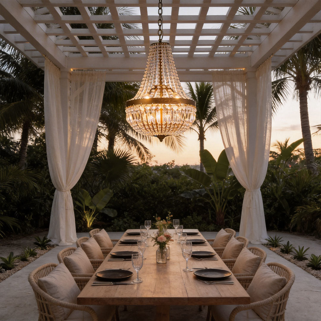 Outdoor hanging lantern light fixtures with a crystal design, providing warm illumination under a pergola.