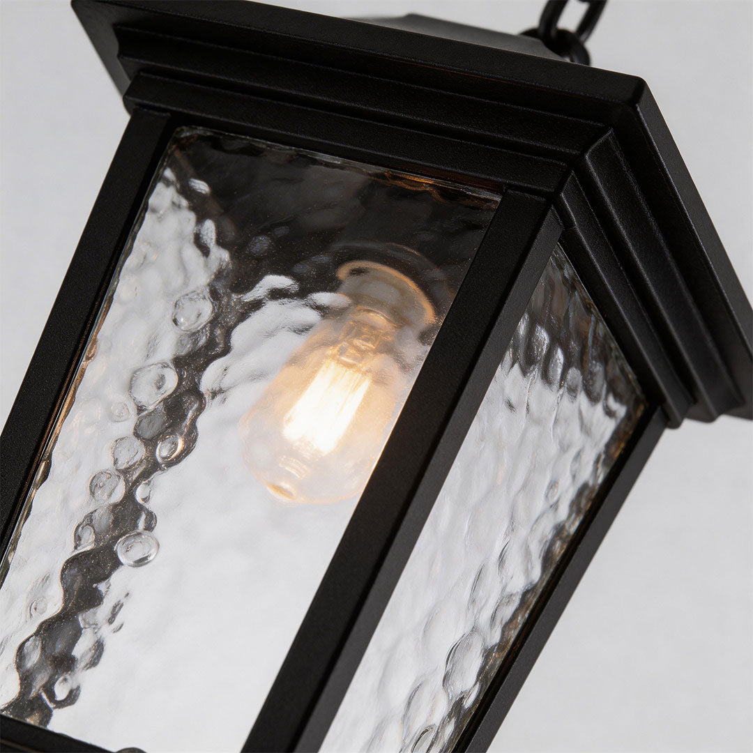 Close-up of outdoor hanging lights for porch showcasing frosted glass panels.