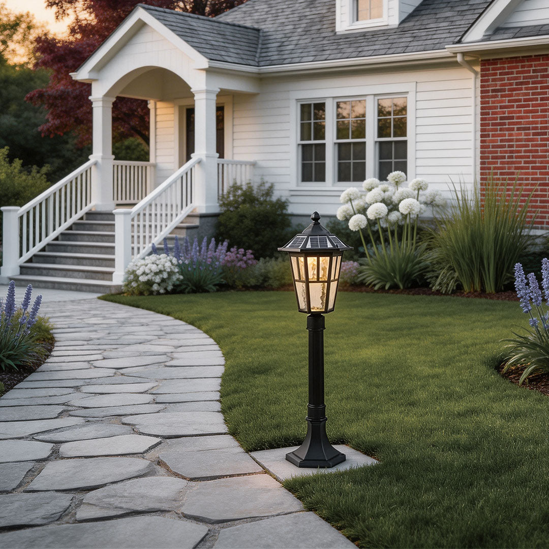 Outdoor landscape path lighting with a classic design, enhancing a front yard walkway.