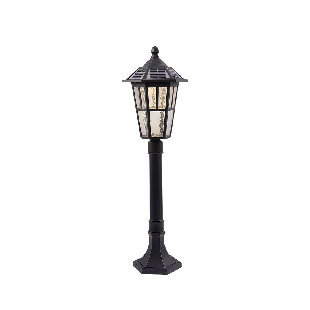Outdoor landscape path lighting with a classic design, mounted on a white pillar.